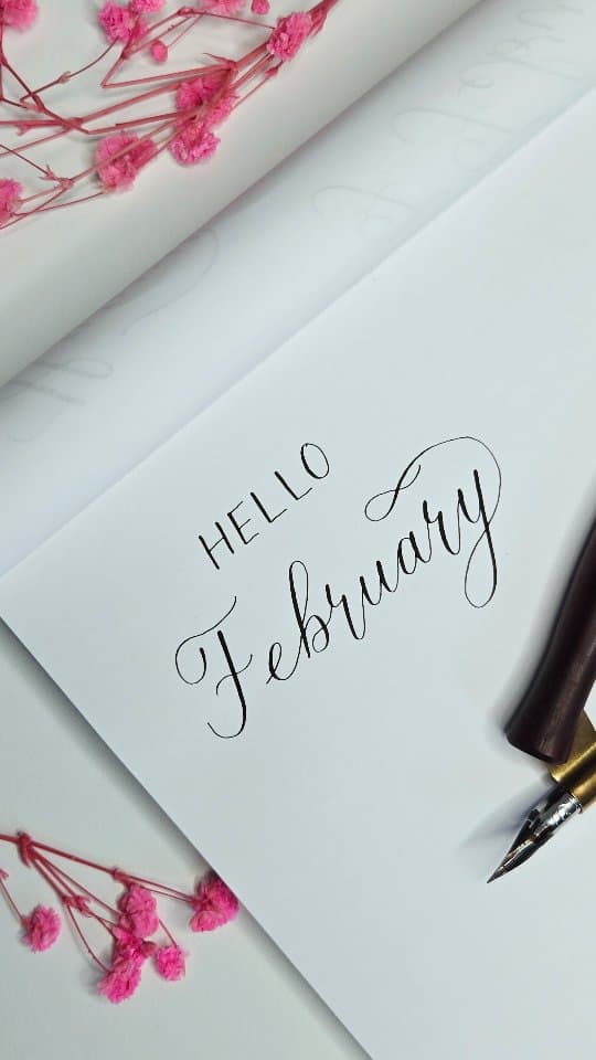 Hello February — flourished calligraphy